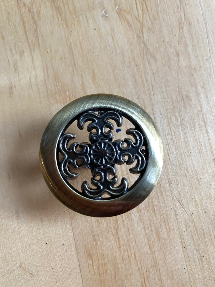 Ornate bronze drawer pull