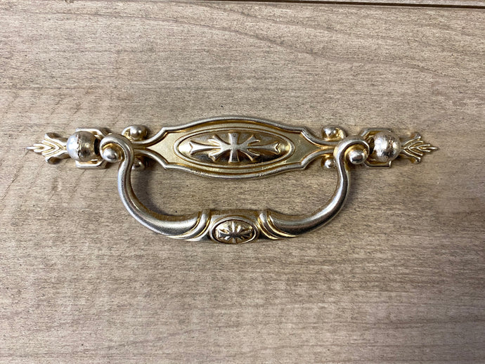 Ornate silver drawer handles