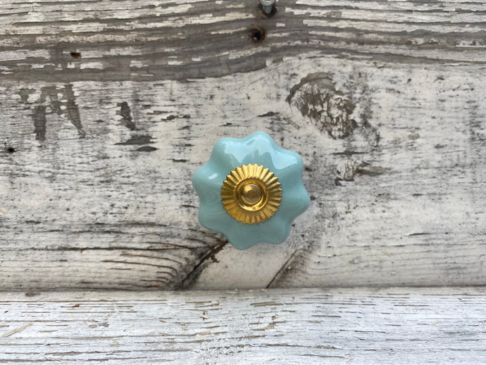 Teal and gold flower shaped knobs
